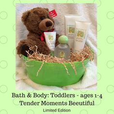 a teddy bear sitting in a green tub with baby products on it's side