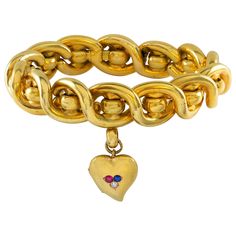 A Victorian gold twist bracelet with gold locket, the bracelet designed as a twist with round rings set between each twist, suspending a gold heart shaped locket set to the centre a ruby, sapphire and diamond, with side opening to reveal two heart shape frames to insert two photographs, circa 1850, measuring approximately 20 x 1.5cm, gross weight 61.3grams. A Victorian bracelet in very good condition. Unmarked tested as 15ct gold. This eye-catching bracelet, c. 1850 was created in the popular Vi Heart Shaped Locket, Twist Bracelet, Victorian Bracelet, Victorian Locket, Heart Shaped Frame, Locket Bracelet, Twisted Bracelet, Gold Armband, Victorian Gold