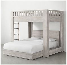 a bunk bed with white sheets and pillows