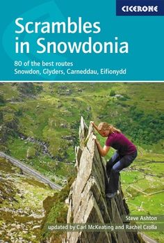 a woman climbing up the side of a mountain with text that reads scrambles in snowdon