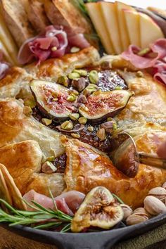 an assortment of breads and meats in a pan