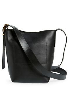 Find MADEWELL Essential Mini Bucket Tote on Editorialist. The Madewell Essential Mini Bucket Tote features a magnetic closure and interior pocket. The mini bucket tote is perfectly sized to hold essential items. It has a shoulder strap and adjustable crossbody strap. It has a structured silhouette with a flat base for stability. Bucket Tote, Mini Bucket, Essential Items, Himalayan, Crossbody Strap, Magnetic Closure, Madewell, Cinnamon, Shoulder Strap