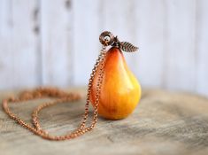 "Long charm necklace with yellow pear pendant, Cute gift jewelry for vegan pear 2\"x 1\" (5x3cm) chain 32\" (80cm) more fruit jewelry https://www.etsy.com/listing/496706714/chunky-charm-pendant-long-boho-necklace?ref=shop_home_active_1 Please, keep the jewellery away from perfume and other alcohol containing fluids because the alcohol damages the Polymer clay. Store the fragile items in separate boxes and treat them with care. Misuse may result in damage. Visit my shop https://www.etsy.com/shop/ Orange Pear-shaped Jewelry For Gifts, Pear-shaped Orange Jewelry Gift, Yellow Teardrop Necklace For Gifts, Handmade Pear-shaped Necklace For Gift, Handmade Pear-shaped Necklace Gift, Pear-shaped Yellow Necklace For Gift, Pear Pendant, Long Necklace Boho, Yellow Fruit