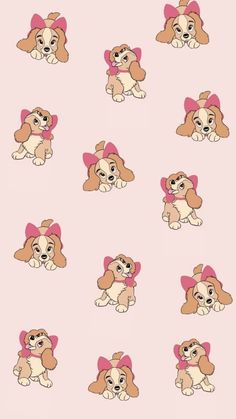 a bunch of dogs with pink bows on their heads and ears, all in different positions