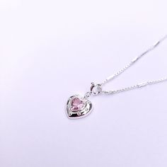 Introducing our Pink Glam Heart Necklace - crafted in Sterling Silver with a heart-shaped pink crystal at its core. This unique chain necklace features a sparkling pink crystal heart pendant, on a Sterling Silver heart shape base adding sophistication to any look. Wear it long or short with the adjustable clasp. Elevate your style with this enchanting piece that radiates love and glamour. Main Stone: heart shaped lab diamond Stone Color: pink Metal Material: 925 Sterling Silver Chain Lenght: 16 Silver Heart-shaped Crystal Necklace With Clavicle Chain, Pink Heart Pendant Charm Necklace With Lobster Clasp, Pink Heart-shaped Charm Necklace With Lobster Clasp, Pink Heart Pendant Charm Necklace, Pink Heart-shaped Charm Necklaces With Lobster Clasp, Pink Heart Pendant Charm Necklace With Clavicle Chain, Pink Heart Pendant Charm Necklace On Clavicle-length Chain, Valentine's Day Sterling Silver Crystal Heart Pendant Necklace, Valentine's Day Heart Pendant Crystal Necklace In Sterling Silver