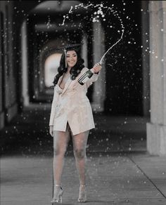 a woman holding an umbrella in the rain