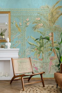 a living room with a chair, fireplace and wallpaper on the walls is shown