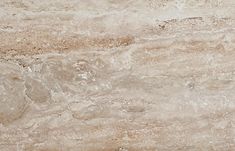 a close up view of a marble tile floor with brown and tan colors on it