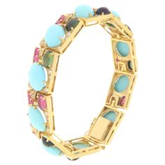 Beautiful bracelet in 14 karat yellow gold mounted with natural turquoise,diamonds,rubies and tourmaline This bracelet was designed and created by Neapolitan goldsmiths. The bracelet is soft on the wrist, it is flashy and adaptable to any type of wrist. A jewel that any woman would like to own. If you need, we are willing to send you further details, images and videos, one of our team will take care of your questions. Turquoise weight 6 grams Diamonds weight 1.08 karat Rubies weight 2.23 karat T Yellow Gold Cuff Bracelet, Gold Cuff Bracelet, Gold Bracelet Cuff, Gold Cuffs, Natural Turquoise, Beautiful Bracelet, Cuff Bracelet, Tourmaline, Cuff Bracelets