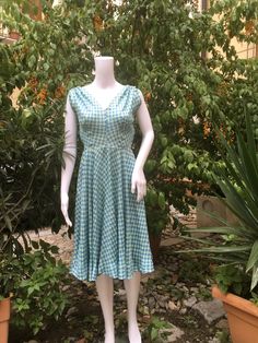 Romantic original 50s summer light blue pattern dress. V cleavage front and back. Small gathering on the shoulders, circle skirt. Hidden zip on the hip. The dress fit a 38/40 italian size (corresponding to a 2/4 US size) measurements: breast circumference 88 cm - 34.64" waist 64 cm - 25.19" free hips length 102 cm - 40.15" No tag. In some point the color is a bit yellowed and there is a faded ink, probably, spot on the skirt, please see pictures. Good vintage condition. NOTE: Items are freshly c Vintage V-neck Midi Dress For Summer, Retro V-neck Dress For Garden Party, 1950s A-line Vintage Summer Dress, Vintage Fit And Flare V-neck Dress, Vintage V-neck Fit And Flare Dress, Vintage V-neck Midi Dress For Garden Party, Retro V-neck Summer Dress, Summer Garden Party Vintage V-neck Dress, Fitted 1950s V-neck Dress