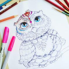 a drawing of an owl with blue eyes