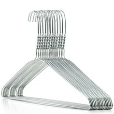 a set of metal clothes hangers on a white background