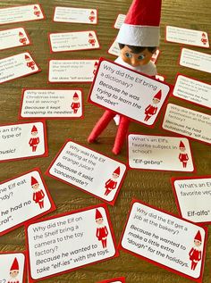 an elf is sitting on the table with several signs