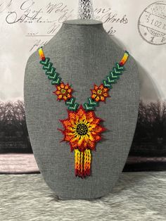 Beautiful set of handmade necklace and earrings, handmade by Mexican artisans Bohemian Multicolor Flower Shaped Jewelry, Traditional Handmade Flowers Jewelry As Gift, Multicolor Flower-shaped Necklaces For Jewelry Making, Artisan Flower Necklace Adjustable, Artisan Flower Necklace With Adjustable Fit, Adjustable Artisan Flower Necklace, Traditional Multicolor Flower Necklace, Traditional Flower Necklaces For Gifts, Traditional Handmade Flower Necklace