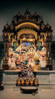 an elaborately decorated shrine with statues and lights