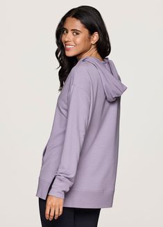 Featuring a functional front pocket and lightweight, breathable french terry fabric, our Long Weekend Hoodie Tunic was designed for versatile wear without sacrificing style. A slightly oversized, tunic length design offers optimal comfort, sleeve scrunching and layering options, while an attached hood with adjustable drawstrings protects you from the elements. Finished with a flattering v-neckline, this legging-friendly pullover can be worn year-round with your favorite active legging or fashion Fleece Long Sleeve Activewear With Pockets, Solid Tops With Side Pockets For Loungewear, Loungewear Tops With Side Pockets, Oversized Athleisure Activewear With Kangaroo Pocket, Oversized Functional Hoodie For Sports, Sporty Oversized Activewear With Kangaroo Pocket, Oversized Sportswear Activewear With Drawstring Hood, Sporty Oversized Activewear For Layering, Solid Color Sweatshirt With Side Pockets For Loungewear