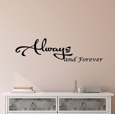 always and forever wall decal on a pink wall in a room with white furniture