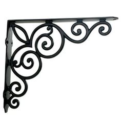 an iron shelf bracket with scrolly design