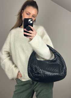 Bottega Veneta's Intrecciato leather hobo bag is the ultimate chic shoulder bag. This one is beautifully made from black leather with gunmetal hardware. When translated to English, intrecciato literally means braided. Bottega Veneta's staple technique involves strips of leather that are intertwined to create a woven pattern, which has become synonymous with the brand. Intrecciato Weave was introduced in the early 1970s and was first used on the brand's handbags. Bottega sell this bag new for £4660. Height: 24cm Width: 40cm Depth: 12cm This bag is in beautiful condition and comes with the original Bottega dust bag. To ensure you’re completely satisfied with your purchase, please refer to the images for the exact condition of the item. Bottega Veneta Hobo Bag, Bottega Bag, Balenciaga Backpack, Gunmetal Hardware, Bottega Veneta Intrecciato, Hobo Shoulder Bag, Woven Pattern, Leather Hobo Bag, Louis Vuitton Shoulder Bag