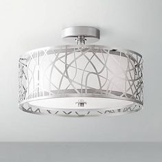 a white ceiling light hanging from the ceiling