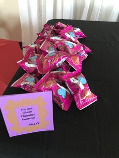 there is a pile of candy on the table next to a sign that says, the one channeler propress