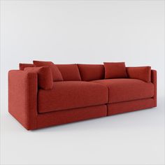 a red couch with pillows sitting on it's back end and the seat up