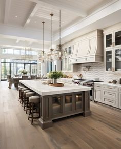 a large kitchen with an island in the middle and lots of counter space around it