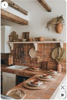 a kitchen counter with plates and bowls on it