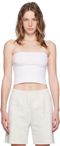 Stretch cotton jersey tube top. · Straight neck · Converts to skirt Supplier color: White Trendy Bandeau Tube Top In Elastane, Trendy Bandeau Tube Top, Trendy Strapless Cotton Tank Top, Solid Fitted Cropped Tube Top, Spring Strapless Elastane Crop Top, Strapless Elastane Crop Top For Spring, Stretch Cotton Cropped Tube Top, Versatile Strapless Tube Top For Spring, Fitted Cotton Tank Top