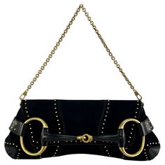 This extra-large black suede Gucci horse-bit shoulder bag was designed by Tom Ford for the Fall/Winter 2003 collection. This large convertible bag features black suede construction with brassy gold hardware and rivets throughout. Various versions of this bag were showcased on the runway that season and in the corresponding ad campaign captured by Mario Testino. This design has recently been reintroduced by Gucci, making this Tom Ford designed original a must-have! Approximate Measurements: Lengt November Moodboard, Tom Ford For Gucci, Gucci By Tom Ford, Tom Ford Gucci, Carolyn Murphy, Gucci Clutch, Gucci Brand, Mario Testino, Gucci Outfits