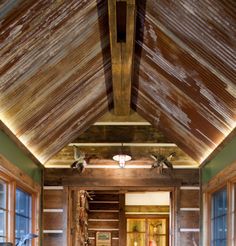 the inside of a log cabin with wood floors