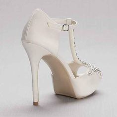 null Wedding Heels With Rhinestones And Single Toe Strap, White T-strap Sandals For Party With Round Toe, Wedding Embellished Heels With Single Toe Strap, Elegant Embellished T-strap Sandals, Elegant White T-strap Sandals With Ankle Strap, Elegant T-strap Sandals For Party, Elegant T-strap Slingback Sandals, Elegant Silver T-strap Sandals, White T-strap Party Sandals