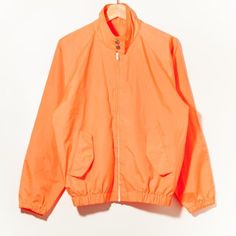 70s Vintage Electric Orange Windbreaker Shop Coat Racing Jacket Single Stitch 60s Made in USA MEDIUM : see measurements for exact fit !!!Measurements: Chest : 22.25"  (Pit To Pit)  Length : 23.5"  (Center Back Neck to Hem)Condition: 9/10 Like New Amazing condition, see photos use ZOOM!!!Material:  100% NylonTag: No Tag / Label Metal Buttons White Zipper HipsterHippie Sportswear American Workwear Nike*PLEASE BE AWARE THESE ITEMS ARE VINTAGE AND SHOW SIGNS OF WEAR. *There may be small stains and m Tommy Hilfiger Hoodie, American Workwear, Vintage Denim Jeans, Orange Jacket, Racing Jacket, Orange Outfit, Neue Outfits, Denim Jean Jacket, Windbreaker Jacket