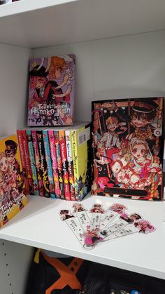 the shelves are filled with anime books and other decorative items for sale in store or at home