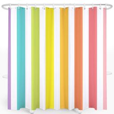 a rainbow shower curtain hanging on the side of a wall