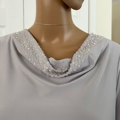 Nwot Beautiful Silver Gray 3/4 Sleeve Liquid Knit With Beaded Cowl Neck And Side Slits. Size Xs Runs Large, More Like A Small. Really Pretty Color And Bead Detail. Elegant Fitted Silver Top, Elegant Metallic Silver Fitted Top, Elegant Silver Tops For Evening, Elegant Silver Evening Tops, Elegant Silver Tops For Wedding, Elegant Silver Wedding Top, Elegant Silver Wedding Tops, Style Tops, Cowl Neck