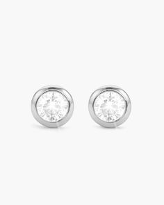 The silver Bezeled Stud Earrings are crafted with beautiful diamond simulants enclosed in a round silver crown. Wear with your favorite t-shirt and jeans or dress them up with a suit and tie. These will be your favorite go-to earrings for all occasions. Solid Gold Chains, Silver Crown, Diamond Simulant, Silver Shop, T Shirt And Jeans, Men's Rings, Pendant Bracelet, Suit And Tie, Cz Stone