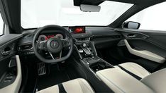 the interior of a car with white leather and black trims, including steering wheel