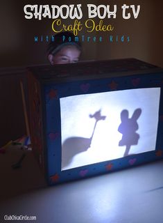 the shadow of a person is projected on a box with a child's shadow