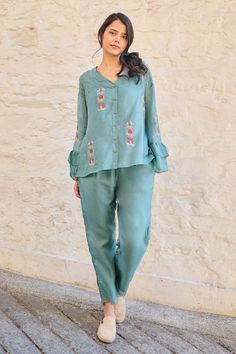 Teal front buttoned top with placement and contrast hand embroidered buttis. Comes along with a separate inner. - Aza Fashions Flower Top, Embroidery Floral, Flower Tops, Flounce Sleeve, Button Top, Top For Women, Pearl Flower, Online Tops, Embroidered Top