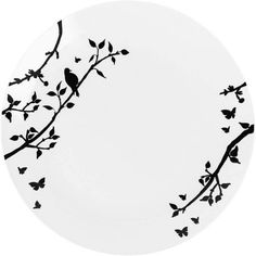 a black and white plate with birds on branches in the center, against a white background