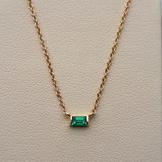 An Absolutely Chic Natural Emerald Solitaire Pendant. It's A Medium-Green, The Perfect Emerald Shade! No Inclusions And Sparkly! This Is A Lively Emerald, Which Is Pretty Difficult To Find In The Baguette Cut. Channel Set Into 14 Karat Yellow Gold. This Necklace Is Adjustable By 3 Sizes! Ranging Between 16 Inches And 18 Inches, Making It Perfect To Wear By Itself Or For Layering Necklaces. (Which Is Very In Style Right Now!) Packaged With A Luxury Gift Box And Complimentary Travel Pouch And Poli Emerald Cut Emerald Necklace, 14k Gold Baguette Necklace For Anniversary, Fine Jewelry With Baguette Gemstones, Gold Emerald Necklace With Baguette Cut For Gift, Baguette-shaped Yellow Gold Jewelry As A Gift, Fine Jewelry In 14k Gold With Baguette Shape, Fine Jewelry 14k Gold Baguette, Yellow Gold Baguette Gemstone Jewelry, Fine Jewelry Baguette 14k Gold