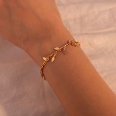 ❤️ Grab 3 fabulous items and enjoy a delightful 25% off when you use the code BUY3GET25 This bracelet features a gold leaf shape tassel, adding a touch of sophistication to her wrist. It's the best gift choice for her, reflecting both your thoughtfulness and her individuality. Embrace the beauty of geometric shapes and the elegance of gold with our bracelets, a perfect accessory to showcase her unique style and make her feel special. #YOU MAY LIKE THIS Personalized Mother of Pearl Bracelet https Gold Plated Chain Bracelet For Her, Trendy Gold Bracelets As Gift For Her, Party Charm Bracelet With Dangle, Gold Plated Dangle Chain Bracelet, Trendy Dangle Charm Bracelet, Trendy Gold Leaf Jewelry, Gold Chain Bracelet As Gift For Her, Minimalist Charm Bracelet For Parties, Gold Leaf Bracelet