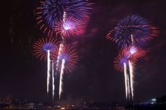 fireworks are lit up in the night sky