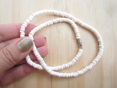 "White puka shell necklace with silver plated screw clasp or lobster clasp in 4 sizes to choose from 14\", 16\", 18\", 20\" . Bright white rounded polished puka beads that measure approximately 1/4\". Now available white puka bracelet (7\") and anklet (10\"). Great addition to your jewelry collection, great gift idea or use it in crafts. Puka shells are gifted to wish good luck to the receiver." White Beaded Necklace With Lobster Clasp For Beach, White Strand Necklace With Lobster Clasp, White Adjustable Beaded Necklace With Lobster Clasp, Adjustable White Beaded Necklace With Lobster Clasp, White Shell Necklaces With Lobster Clasp, White Shell Necklace With Lobster Clasp As Gift, White Beaded Necklaces For The Beach, White Beaded Necklaces For Beach, White Round Beaded Necklaces For The Beach