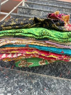 a pile of cloth sitting on top of some steps