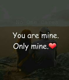 two people sitting on rocks with the words you are mine only mine