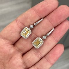 2.76+2.50 Light Yellow (U-V Range) Center Diamonds VS1+VS2 Emerald Cut Diamonds 0.84 carats of round white diamonds Designed to enhance yellow colors Handmade in New York Set in platinum GIA Certified Diamond Ready to ship Emerald Cut Diamond Earrings, Diamond Lighting, Yellow Diamonds, Emerald Cut Diamond, Diamond Drop Earrings, Emerald Cut Diamonds, Diamond Design, Yellow Diamond, Gia Certified Diamonds