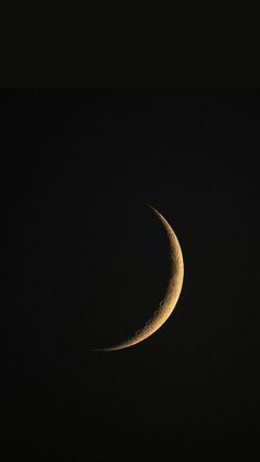 the half moon is seen in the dark night sky with only one light on it