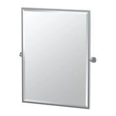 a bathroom mirror that is on top of a white wall mounted cabinet and has a metal handle